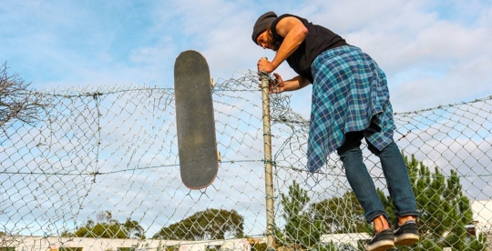 man climbing fence