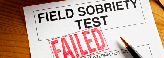 Sobriety test paperwork on a desktop. Stamped with a FAILED.
