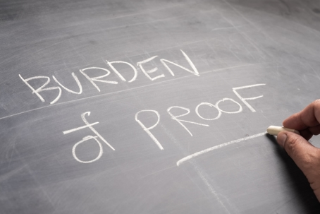 Burden of Proof written on a chalkboard